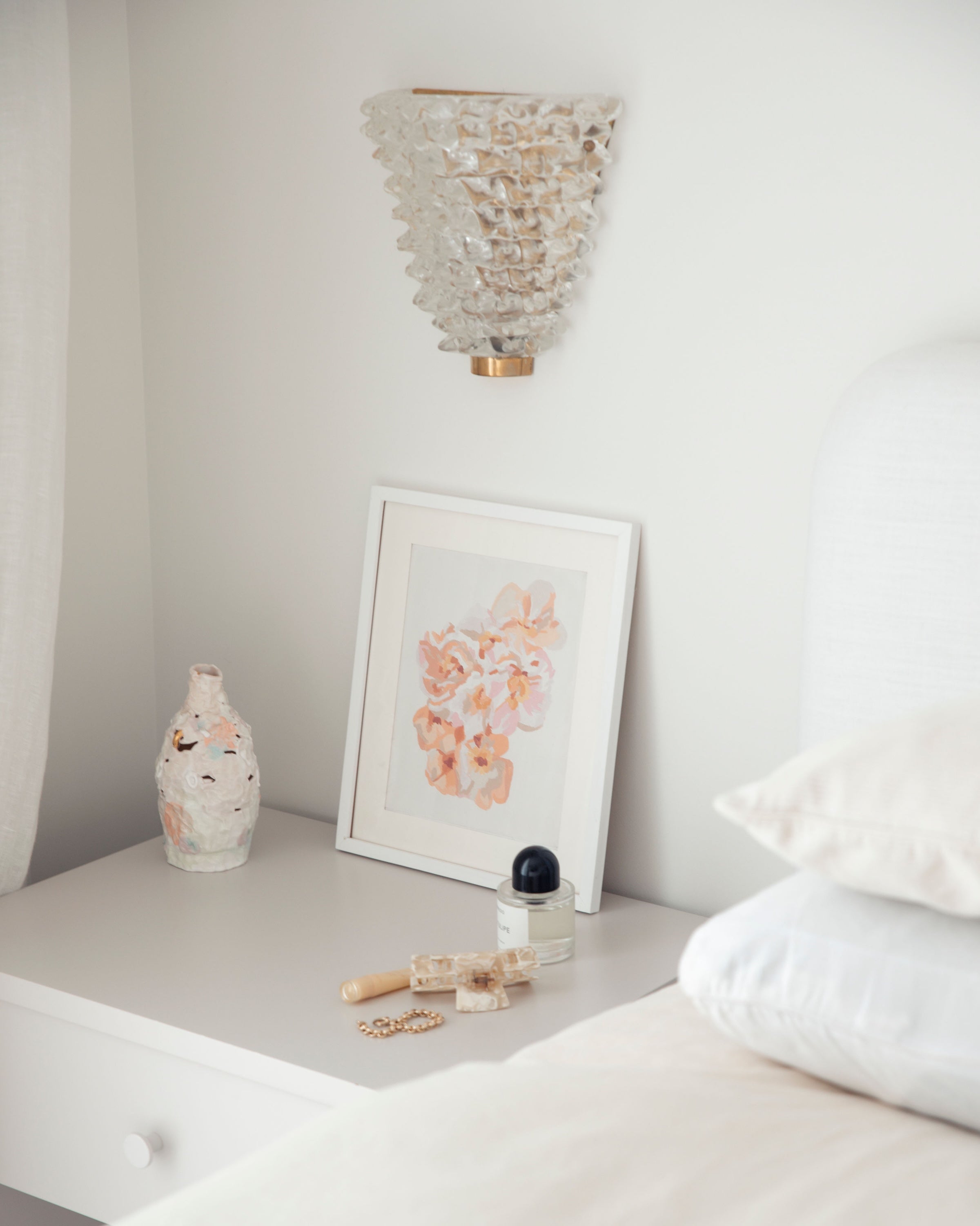 Paint Like Frida Little Bunch Mini Rolled Canvas in White Frame on top of a bedside table