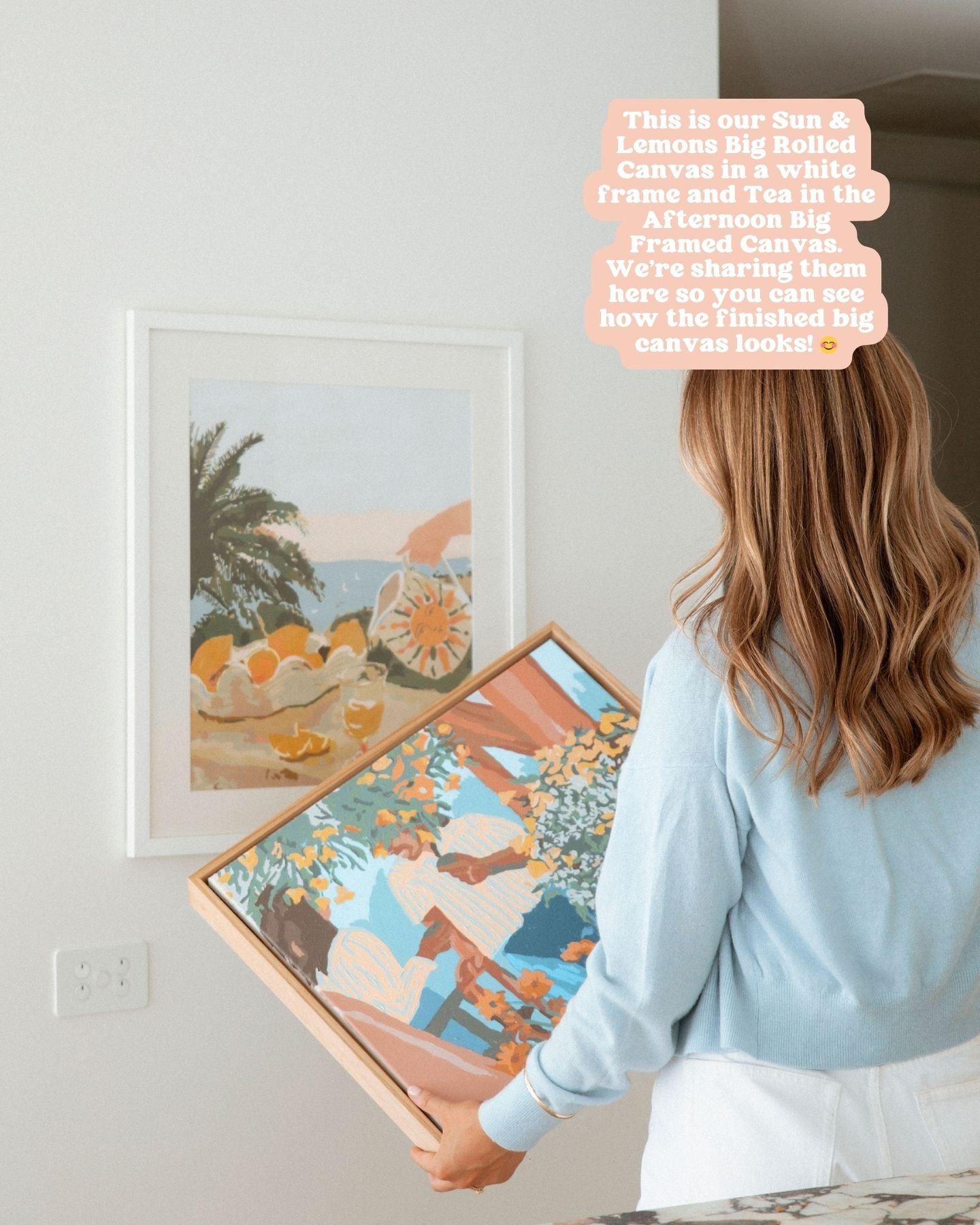 Sun & Lemons Big Rolled Canvas in a white frame hanging on the wall and Tea in the Afternoon Big Framed Canvas attached to a customised wooden frame