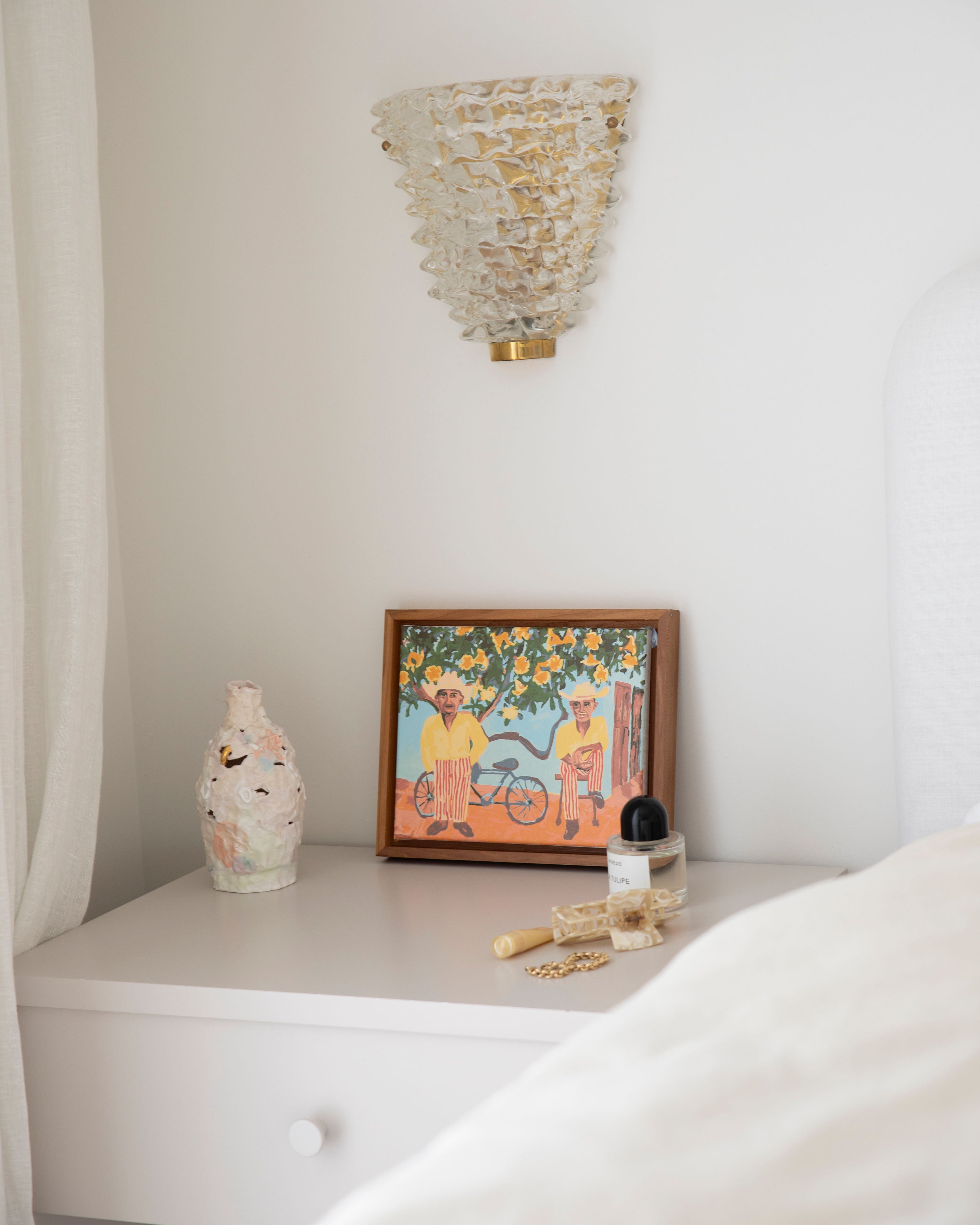 Paint Like Frida Two Cups of Gold Mini Framed Canvas on top of a bedside table