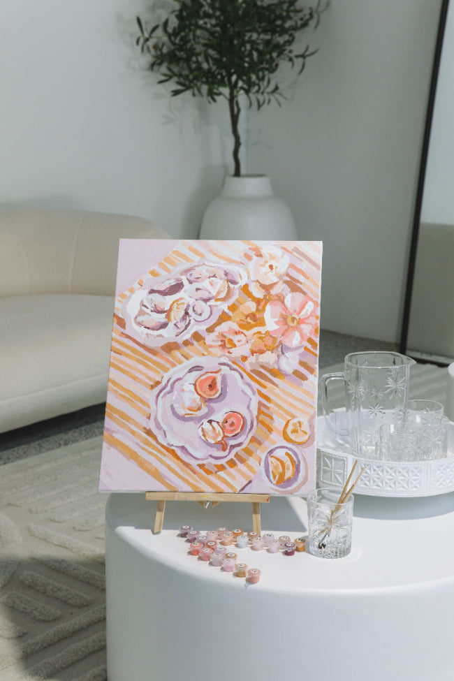 Paint Like Frida Holiday Brunch big framed kit in an easel at a paint and sip