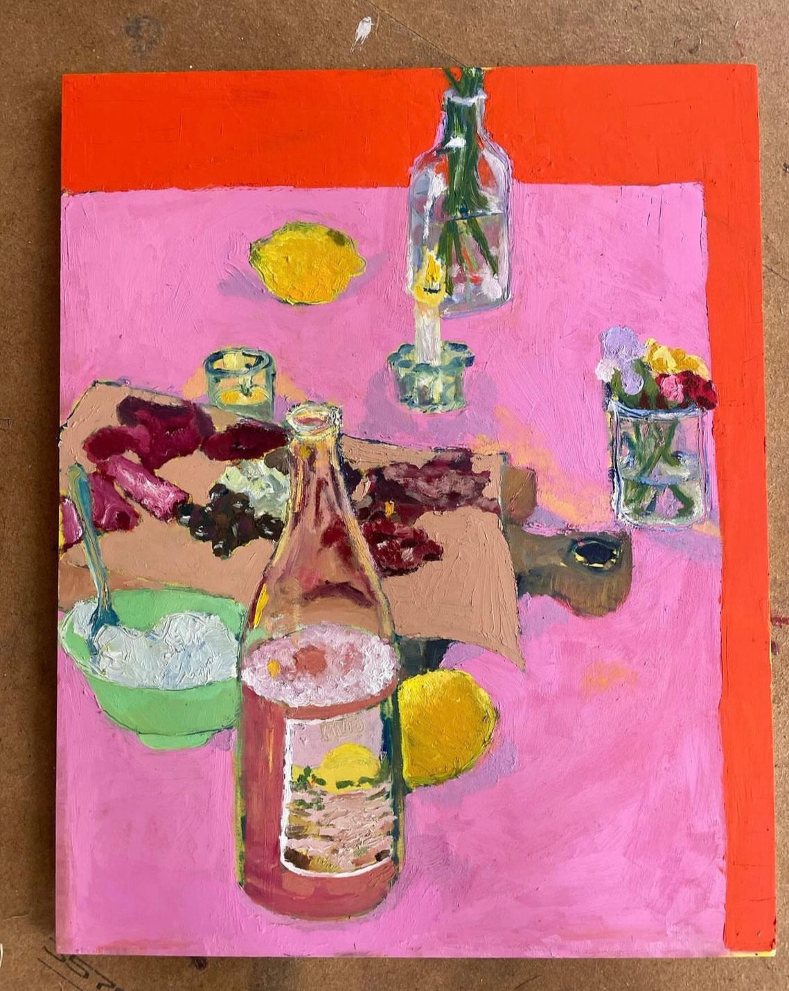 Painting of artist Jade Cummings - a pink and red tablescape with wine and cheese featuring in the foreground