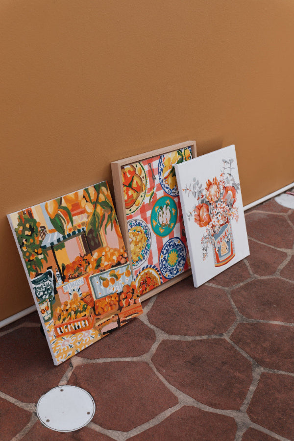 Completed Paint Like Frida paintings in big framed canvases.