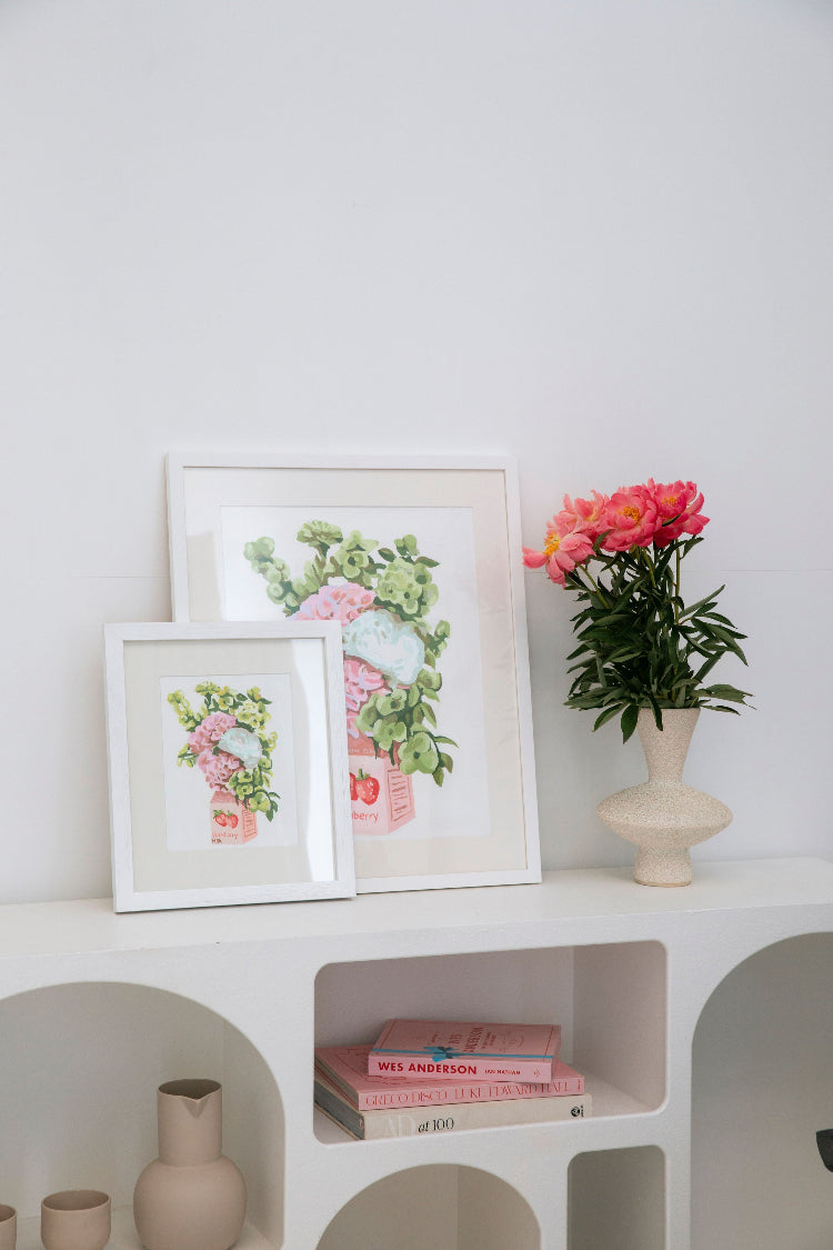 Paint Like Frida Strawberry Milk rolled kits framed in white minimalist frames